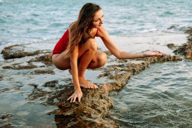 Portrait of a woman on the beach, ocean, unity with nature, healthy lifestyle