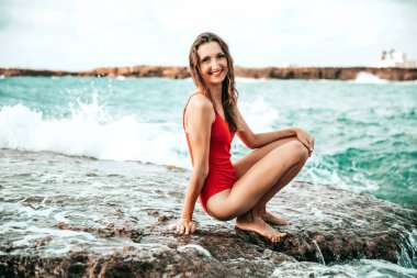 Portrait of a woman on the beach, ocean, unity with nature, healthy lifestyle