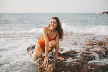 Portrait of a woman on the beach, ocean, unity with nature, healthy lifestyle