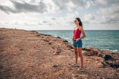 Portrait of a woman on the beach, ocean, unity with nature, healthy lifestyle