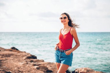 Portrait of a woman on the beach, ocean, unity with nature, healthy lifestyle