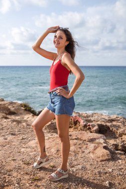 Portrait of a woman on the beach, ocean, unity with nature, healthy lifestyle