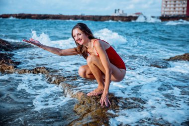 Portrait of a woman on the beach, ocean, unity with nature, healthy lifestyle