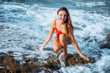 Portrait of a woman on the beach, ocean, unity with nature, healthy lifestyle