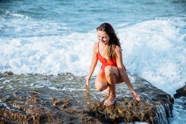 Portrait of a woman on the beach, ocean, unity with nature, healthy lifestyle