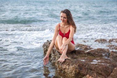 Portrait of a woman on the beach, ocean, unity with nature, healthy lifestyle