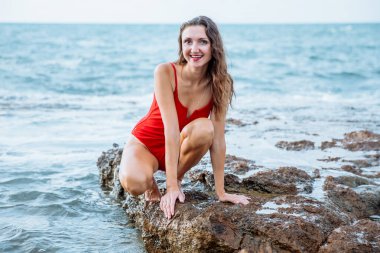 Portrait of a woman on the beach, ocean, unity with nature, healthy lifestyle