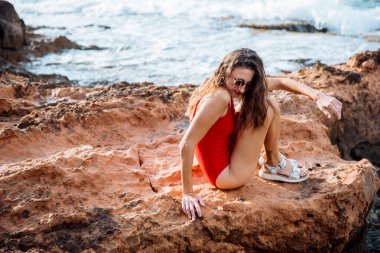 Portrait of a woman on the beach, ocean, unity with nature, healthy lifestyle