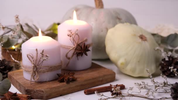 Thanksgiving concept autumn composition with pumpkin and burning candles — Stock Video