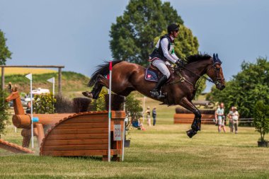 Strzegom Horse Trials, Morawa, Poland - June, 25, 2022: Polish Jan Kaminski on horse Jard, on the Cross Country route during the competition.