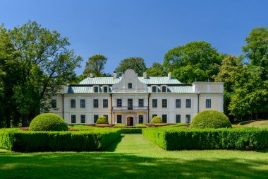 The Mieroszewski Palace in Bedzin, front view of the well-preserved building with the palace garden. Summer sunny day.