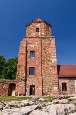 Castle in Toszek, a brick castle from the 15th century, partially reconstructed. View from the green courtyard to the building.