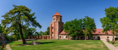 Castle in Toszek, a brick castle from the 15th century, partially reconstructed. View from the green courtyard to the building.