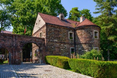 Castle in Toszek, a brick castle from the 15th century, partially reconstructed. View of the main entrance to the castle leading to the courtyard.