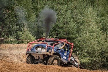 Kunstat, Czech Republic - August 14, 2022: Unidentified truck at difficult muddy terrain during truck trial National championship show of Czech Republic 2022  in Kunstat.