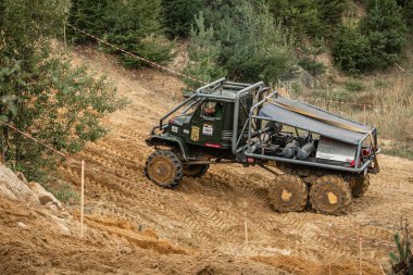 Kunstat, Czech Republic - August 14, 2022: Unidentified truck at difficult muddy terrain during truck trial National championship show of Czech Republic 2022  in Kunstat.