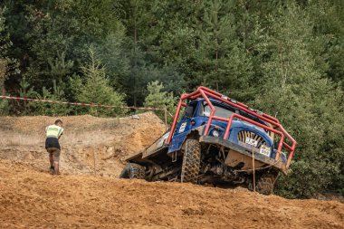 Kunstat, Czech Republic - August 14, 2022: Unidentified truck at difficult muddy terrain during truck trial National championship show of Czech Republic 2022  in Kunstat.