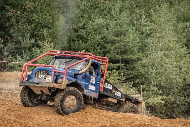 Kunstat, Czech Republic - August 14, 2022: Unidentified truck at difficult muddy terrain during truck trial National championship show of Czech Republic 2022  in Kunstat.