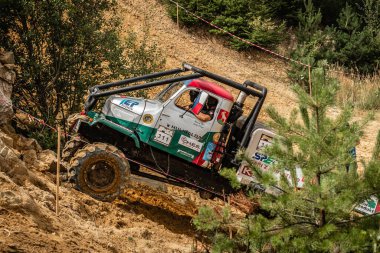 Kunstat, Czech Republic - August 14, 2022: Unidentified truck at difficult muddy terrain during truck trial National championship show of Czech Republic 2022  in Kunstat.