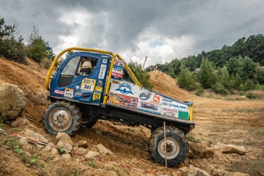 Kunstat, Czech Republic - August 14, 2022: Unidentified truck at difficult muddy terrain during truck trial National championship show of Czech Republic 2022  in Kunstat.