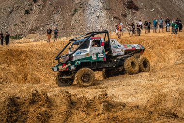 Kunstat, Czech Republic - August 14, 2022: Unidentified truck at difficult muddy terrain during truck trial National championship show of Czech Republic 2022  in Kunstat.