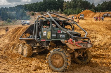 Kunstat, Czech Republic - August 14, 2022: Unidentified truck at difficult muddy terrain during truck trial National championship show of Czech Republic 2022  in Kunstat.
