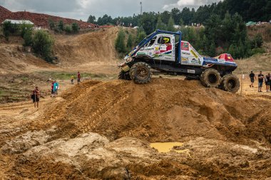 Kunstat, Czech Republic - August 14, 2022: Unidentified truck at difficult muddy terrain during truck trial National championship show of Czech Republic 2022  in Kunstat.