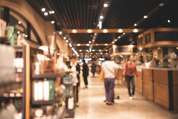 Abstract blurred of crowd people in coffee shop or cafe restaurant with light bokeh for  background