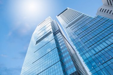 Low angle view of skyscraper with architecture and glass window exterior of building around business area in Hong Kong