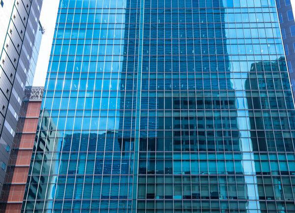 Modern building, Modern glass wall silhouettes of skyscrapers in the city