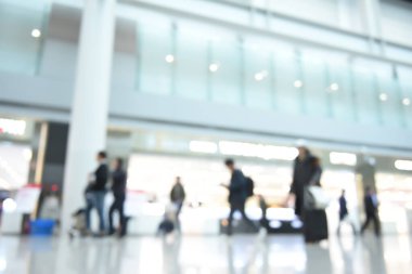 Blurred of crowd people, businessman walking at airport interior.  Customer with shopping bag walking and shopping interior luxury department store, motion blur for business background