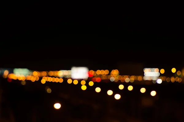 Abstract highway light bokeh in the city at night with copy space.