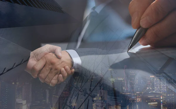 Business agreement, deal concept. Double exposure of business men handshake for successful of investment deal, hand signing contract and city night background.