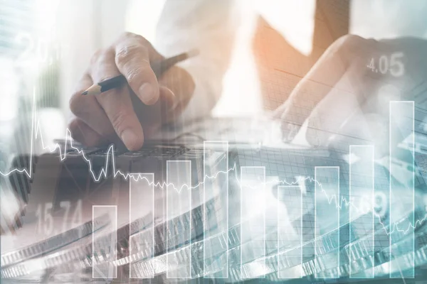 Business analysis, financial investment concept. Double exposure of businessman analyzing stock market, economic trend and bank buildings in the city with financial graph on virtual screen