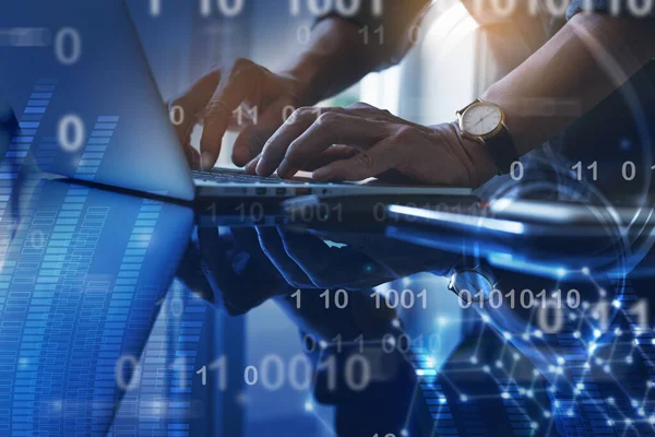 Internet technology, digital software  development, IoT concept. Coding programmer, software developer working on smart phone and laptop with binary, computer code, big data on abstract technology on virtual screen