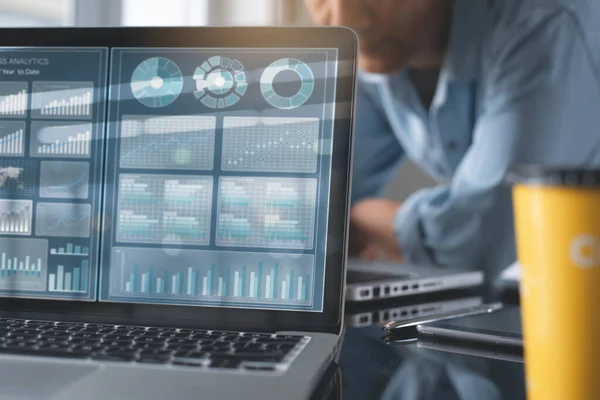 Business analysis and teamwork concept. Business man team having discussion, co-working and monitoring financial graph data, marketing report on laptop computer in modern office
