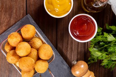 Brazilian snacks, stuffed fried balls.