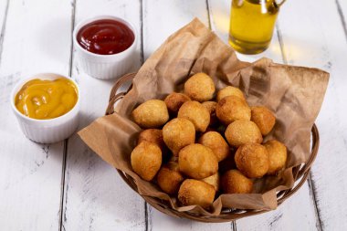 Brazilian snacks, stuffed fried balls.