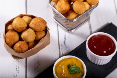 Brazilian snacks, stuffed fried balls.