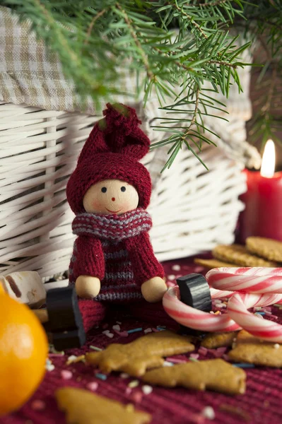 Decorative wooden doll on christmas background. Close-up. — Stock Photo, Image