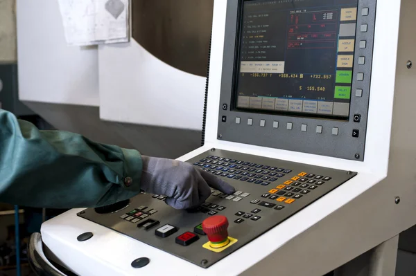Hand on the control panel of a cnc programmable machine — Stock Photo, Image