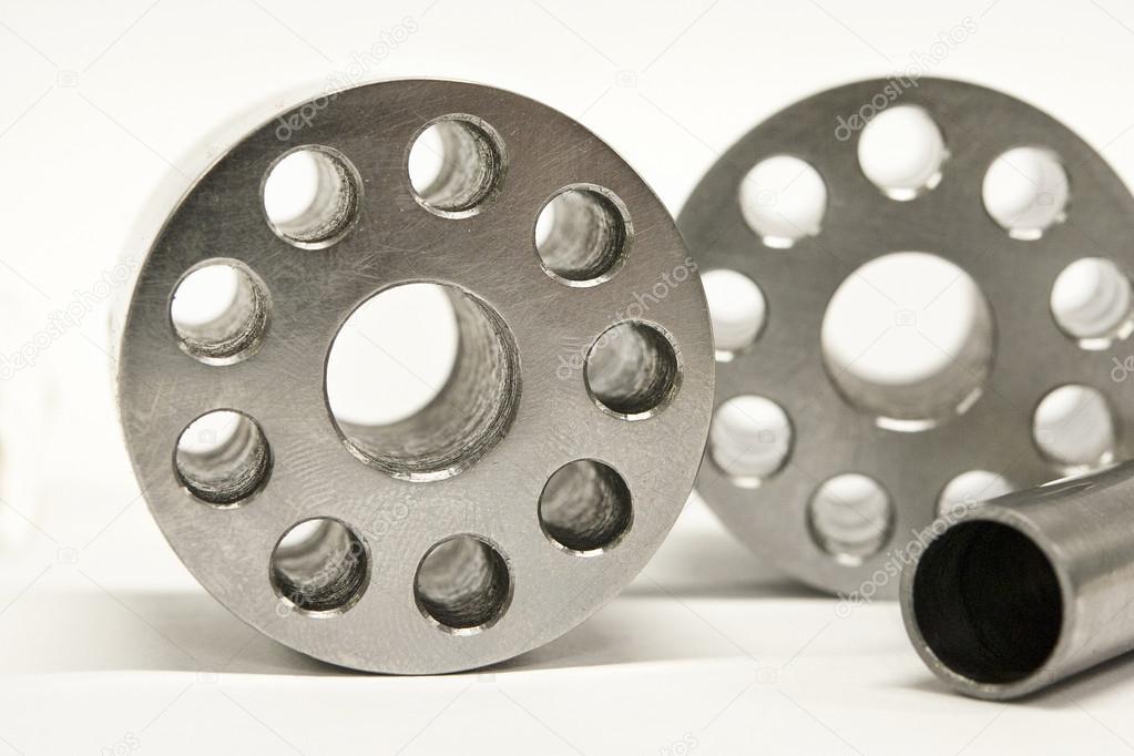 Metal flanges and cylinders.  Milling industry. Close-up.