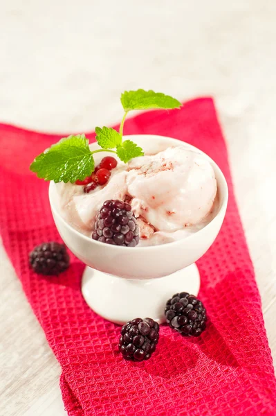 Fruit ice-cream with berries and mint in porcelain bowl. — Stock Photo, Image