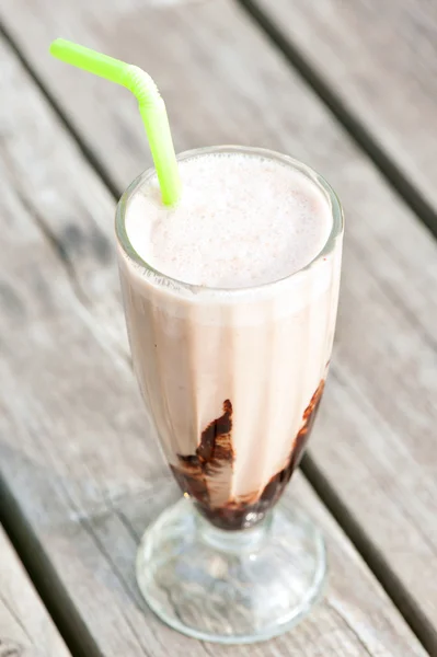 Protein snack. Ice-cream milkshake with chocolate. Outdoors clos