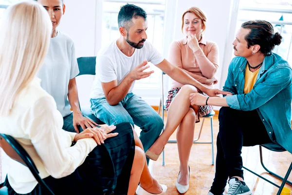 People have conversation on Support group talking about life. Diverse Millennial employees with new ideas on casual meeting