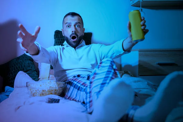 Man Watching Television While Laying Bed Beer Can Popcorns Night — Stockfoto