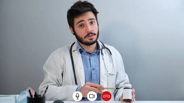Laptop videocall screenshot of a young doctor talking about pills. — Zdjęcie stockowe