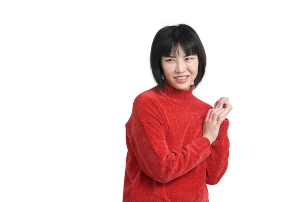 Young asian woman with disgusted expression wearing red sweater, isolated. — Stock Photo, Image
