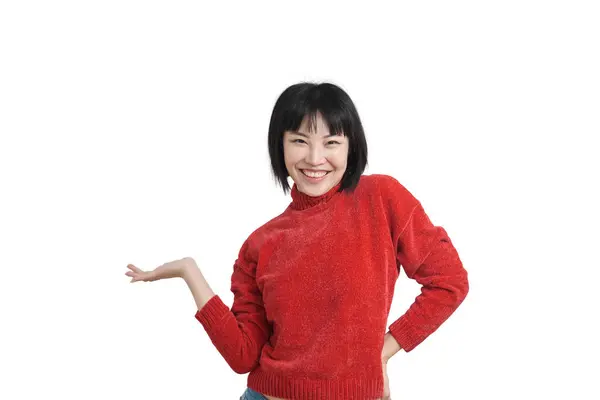 Young asian woman smiling and presenting something, isolated. — Stockfoto