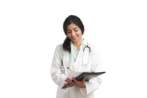 Young Venezuelan female doctor writing a medical report, isolated. — Zdjęcie stockowe